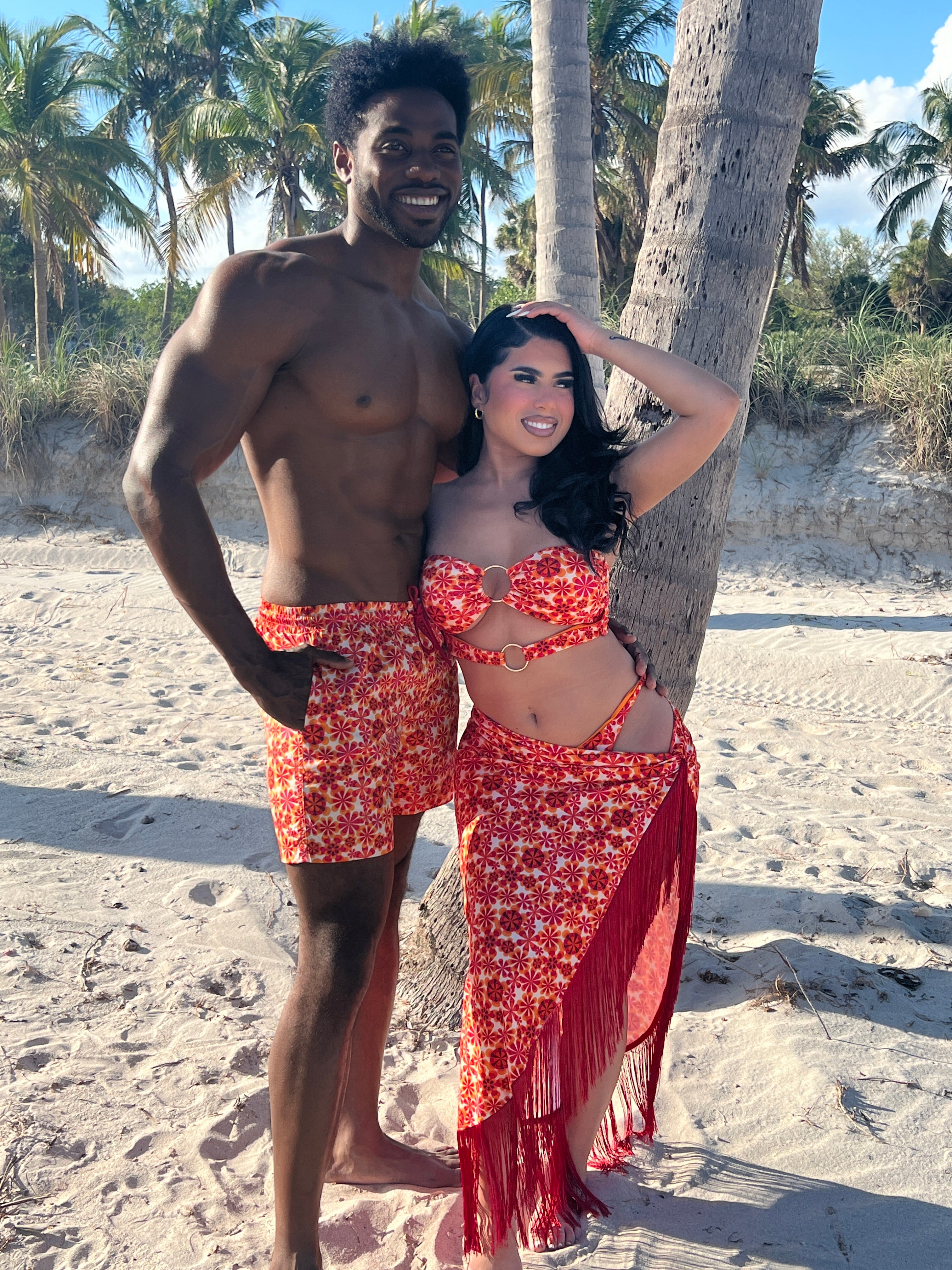 Husband and wife shops matching swimwear